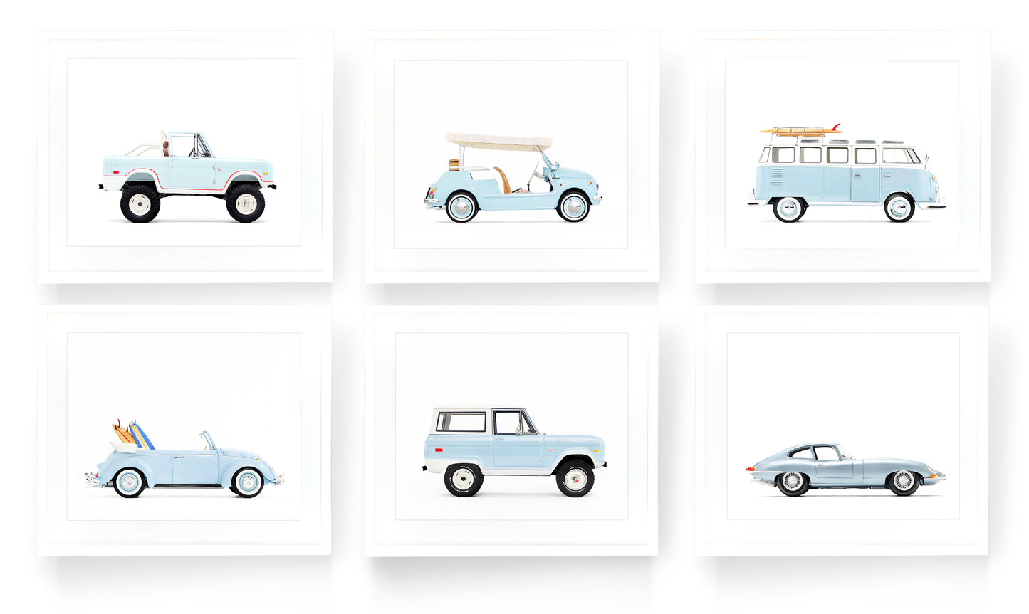 A gallery wall set of six vintage classic car art prints in powder blue on a white background, featuring a Ford Bronco, Fiat Jolly, and VW Bus, styled for a sophisticated boy’s nursery or playroom.