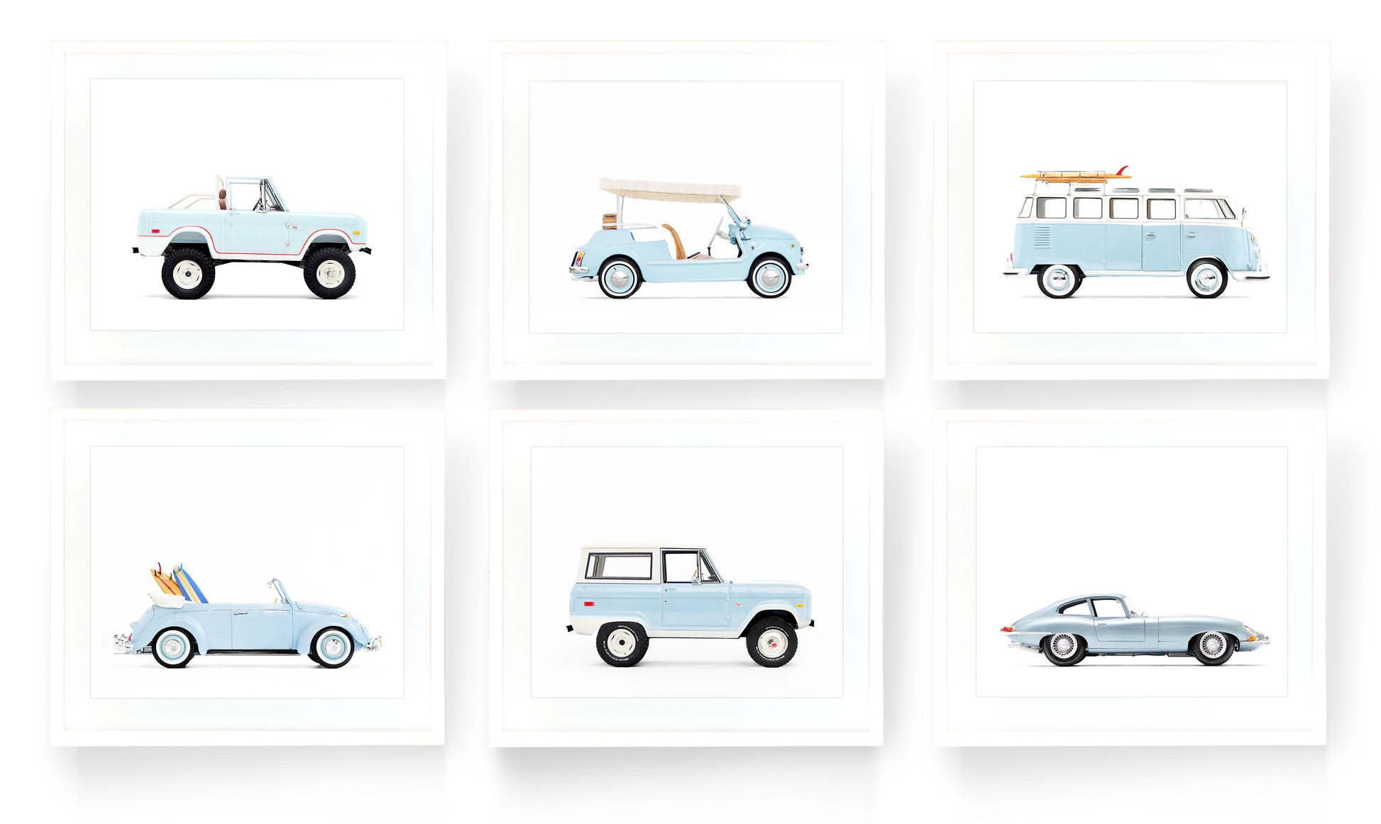 A gallery wall set of six vintage classic car art prints in powder blue on a white background, featuring a Ford Bronco, Fiat Jolly, and VW Bus, styled for a sophisticated boy’s nursery or playroom.